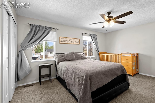 537 Blossom Field Rd, Fountain, CO 80817 - bedroom featuring carpet floors, a textured ceiling, and multiple windows