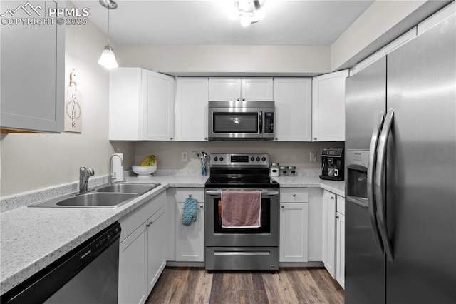 537 Blossom Field Rd, Fountain, CO 80817 - kitchen featuring white cabinets, stainless steel appliances, light countertops, and a sink