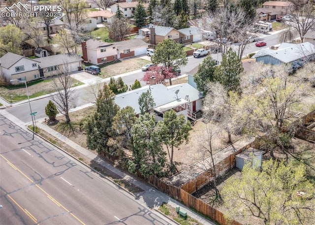 birds eye view of property with a residential view