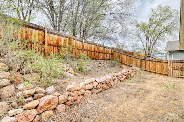 view of yard with a fenced backyard