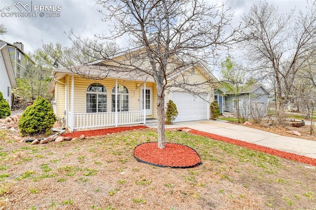 view of front of home with an attached garage, concrete driveway, and covered porch