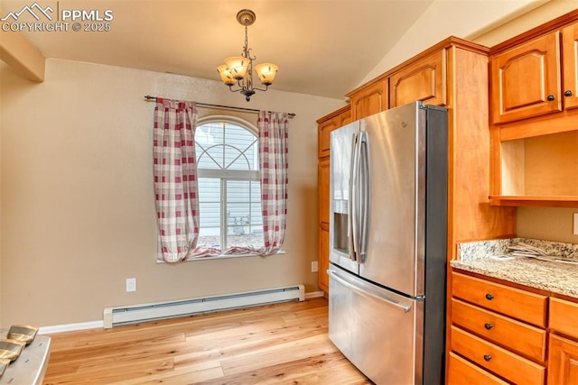 kitchen with a baseboard heating unit, stainless steel fridge, an inviting chandelier, light wood-style flooring, and lofted ceiling