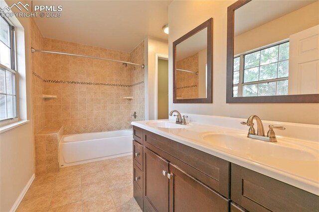 full bath featuring double vanity, shower / bathtub combination, and tile patterned flooring