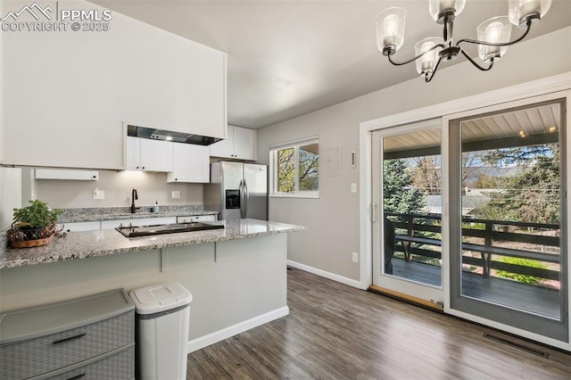 kitchen with baseboards, visible vents, an inviting chandelier, white cabinets, and stainless steel fridge with ice dispenser