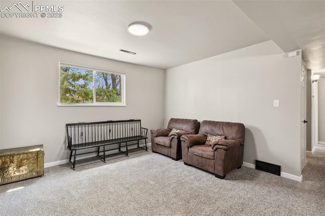 living room with carpet floors, baseboards, and visible vents
