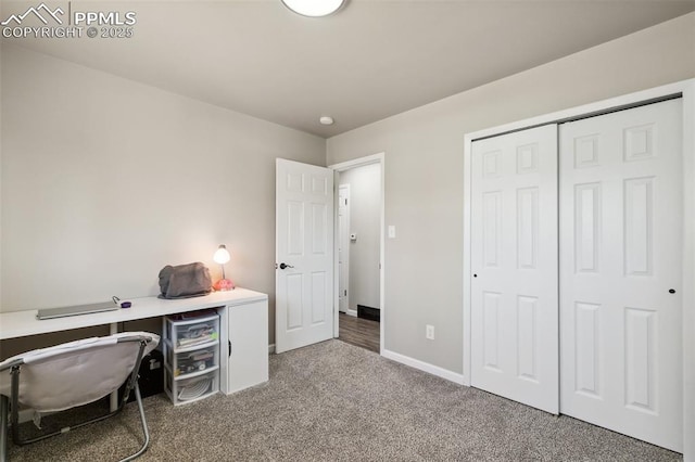 home office with baseboards and carpet flooring