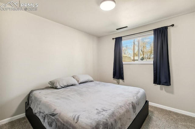 bedroom with visible vents, baseboards, and carpet floors