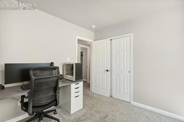 office area with baseboards and light colored carpet