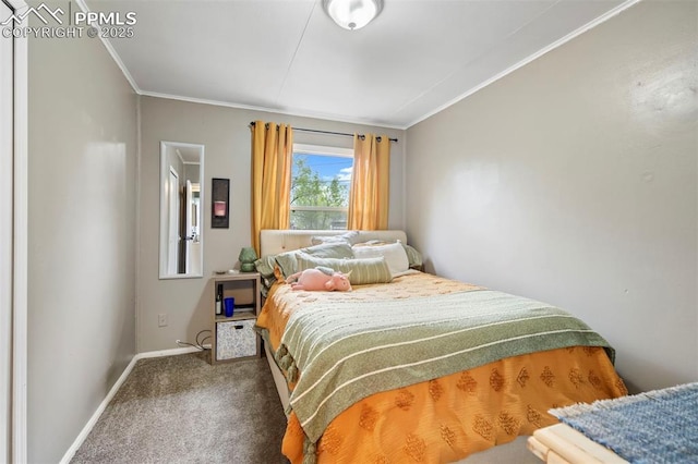 bedroom featuring ornamental molding, carpet flooring, and baseboards