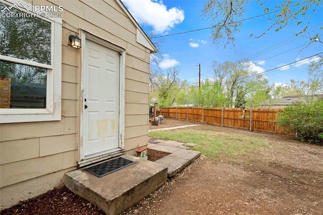 view of outbuilding with fence