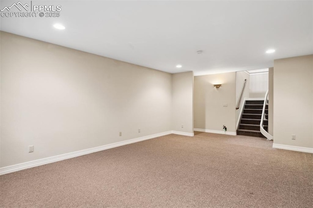 finished basement with carpet floors, baseboards, recessed lighting, and stairway