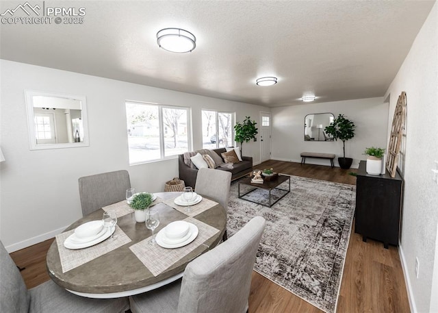 2204 Bonfoy Ave, Colorado Springs, CO 80909 - dining space with baseboards and wood finished floors