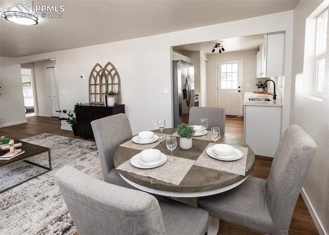 2204 Bonfoy Ave, Colorado Springs, CO 80909 - dining area featuring baseboards and wood finished floors