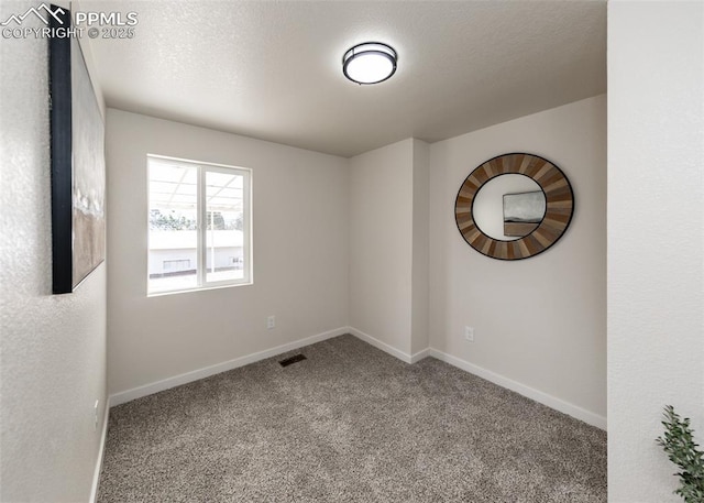 2204 Bonfoy Ave, Colorado Springs, CO 80909 - unfurnished room featuring visible vents, baseboards, and carpet floors