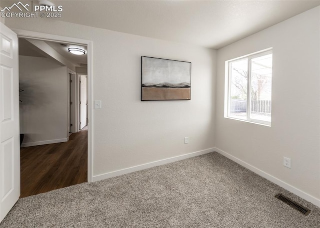 2204 Bonfoy Ave, Colorado Springs, CO 80909 - spare room featuring visible vents, carpet flooring, and baseboards