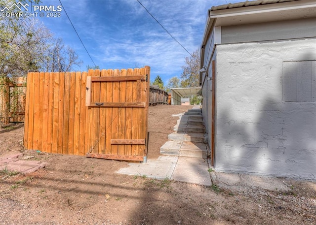 2204 Bonfoy Ave, Colorado Springs, CO 80909 - view of property exterior featuring a gate and fence