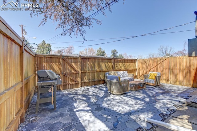 view of patio / terrace featuring a fenced backyard and outdoor lounge area