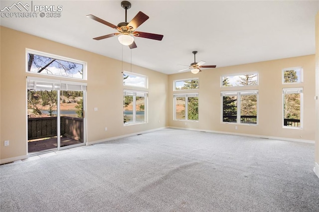 carpeted empty room with baseboards and ceiling fan