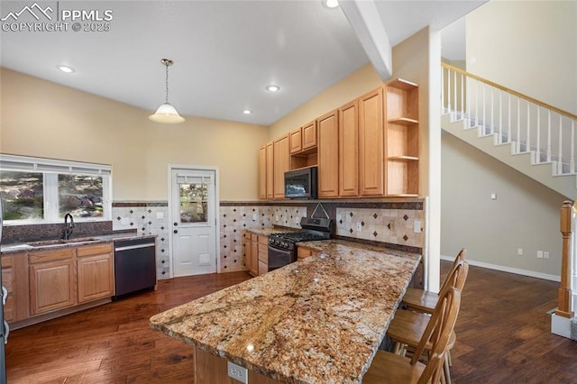 kitchen featuring open shelves, a sink, a peninsula, dark stone counters, and stainless steel appliances