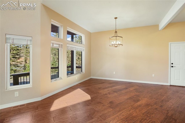 empty room featuring an inviting chandelier, baseboards, visible vents, and a healthy amount of sunlight
