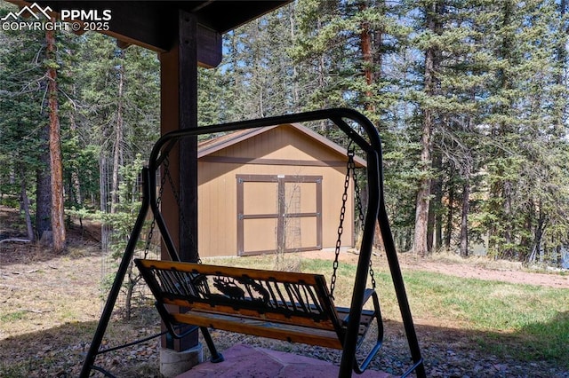 view of shed with a wooded view