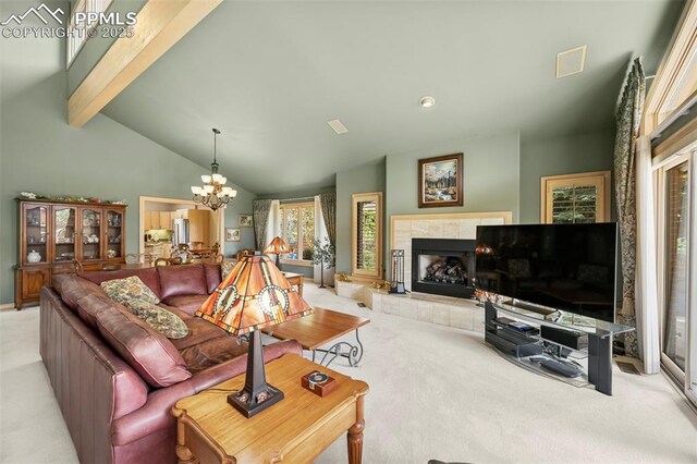 living area featuring lofted ceiling with beams, a notable chandelier, light colored carpet, and a fireplace