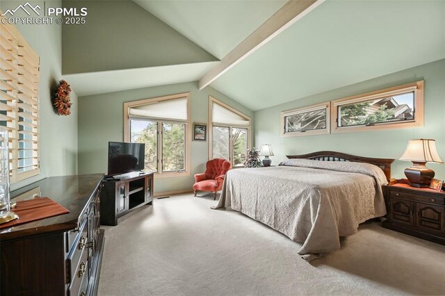 bedroom featuring lofted ceiling with beams, carpet flooring, and multiple windows