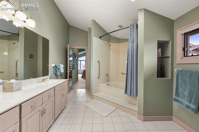 bathroom featuring vanity, shower / bathtub combination, tile patterned floors, baseboards, and lofted ceiling