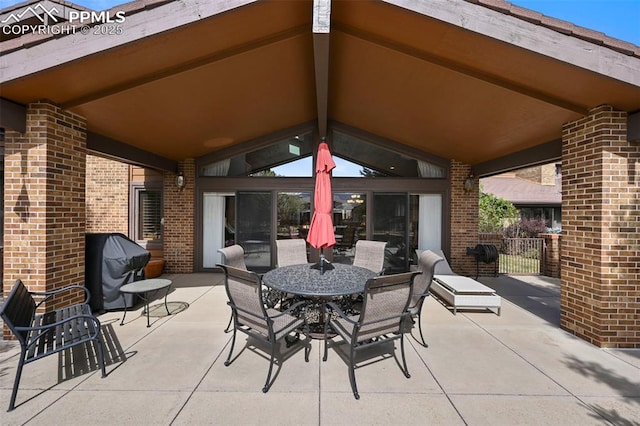 view of patio featuring outdoor dining area