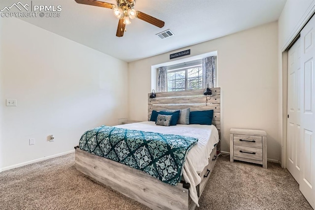 carpeted bedroom featuring visible vents, a ceiling fan, baseboards, and a closet