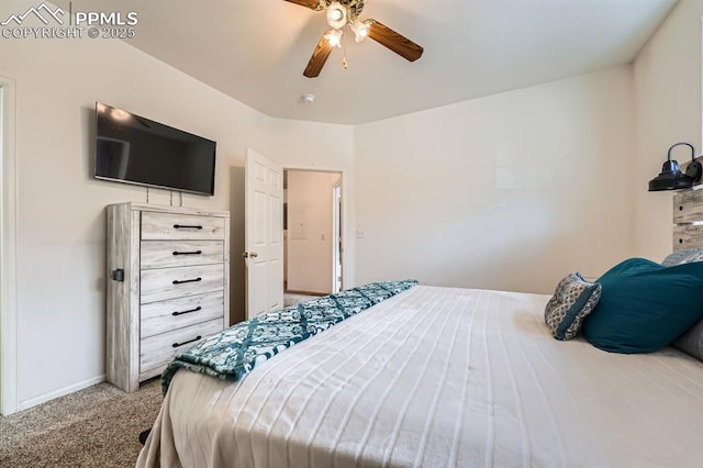 bedroom with ceiling fan, baseboards, and carpet