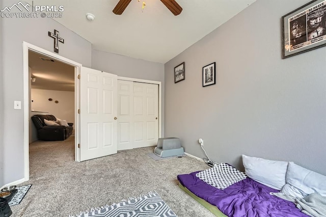 bedroom with carpet floors, ceiling fan, and a closet