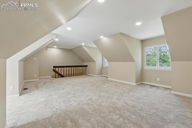bonus room with carpet, recessed lighting, baseboards, vaulted ceiling, and visible vents