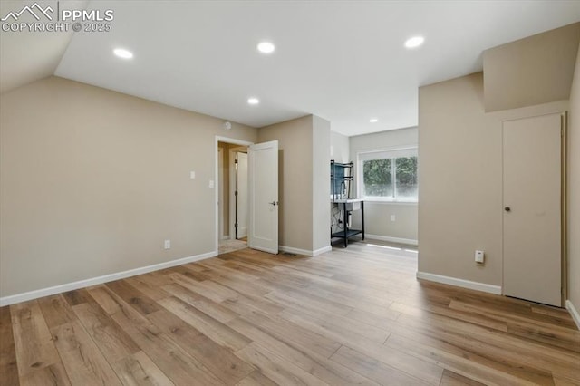 interior space featuring baseboards, recessed lighting, and light wood-style flooring