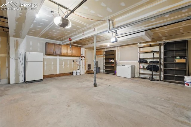 garage with a garage door opener, freestanding refrigerator, and refrigerator