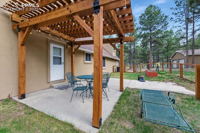 view of patio / terrace featuring fence and a pergola