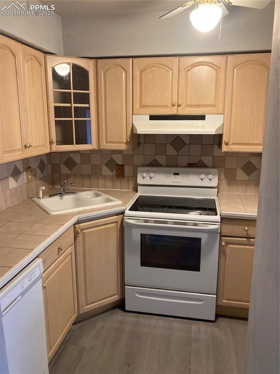 1708 Sawyer Way Unit 178, Colorado Springs, CO 80915 - kitchen featuring tile counters, under cabinet range hood, white appliances, and light brown cabinetry