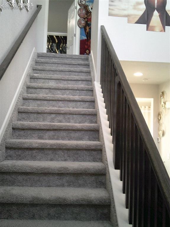 stairs featuring baseboards