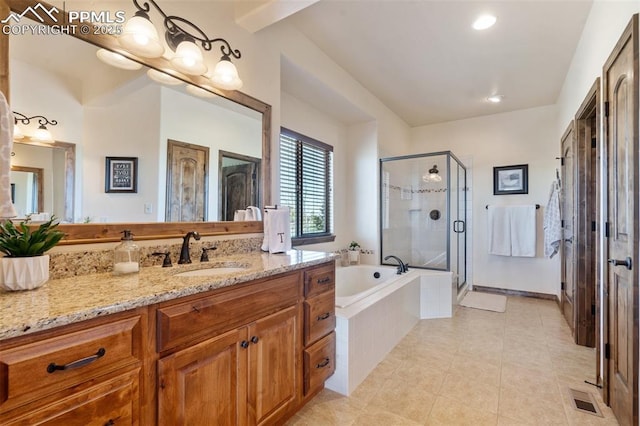 4908 Silver Nell Dr, Colorado Springs, CO 80908 - bathroom featuring vanity, tile patterned floors, visible vents, a bath, and a stall shower