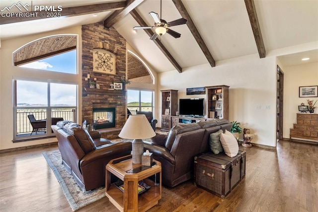 4908 Silver Nell Dr, Colorado Springs, CO 80908 - living area with baseboards, high vaulted ceiling, beam ceiling, and a fireplace