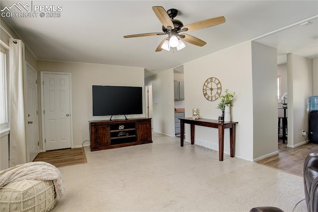 409 Columbine St, Fountain, CO 80817 - living area featuring ceiling fan and baseboards