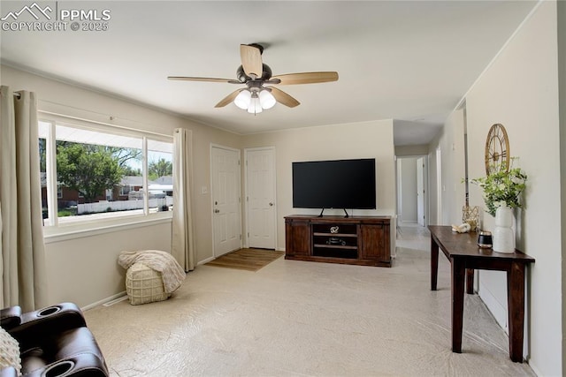 409 Columbine St, Fountain, CO 80817 - living area with a ceiling fan, baseboards, and light carpet