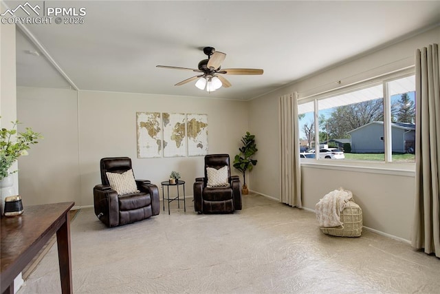409 Columbine St, Fountain, CO 80817 - living area featuring a ceiling fan, carpet floors, and baseboards