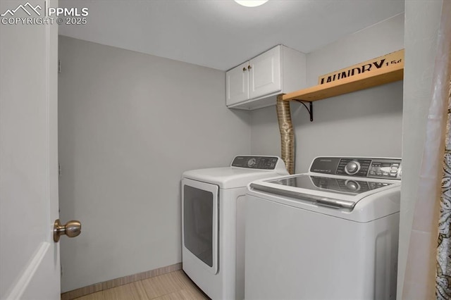 5064 Artistic Cir, Colorado Springs, CO 80917 - clothes washing area featuring baseboards, cabinet space, and washer and dryer