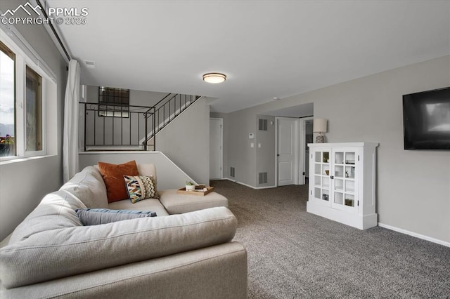 5064 Artistic Cir, Colorado Springs, CO 80917 - carpeted living area with baseboards, stairs, and visible vents