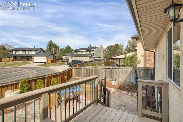 5064 Artistic Cir, Colorado Springs, CO 80917 - wooden terrace featuring a residential view and a fenced backyard