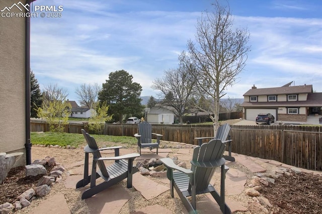 5064 Artistic Cir, Colorado Springs, CO 80917 - view of patio featuring a fenced backyard and an outdoor fire pit