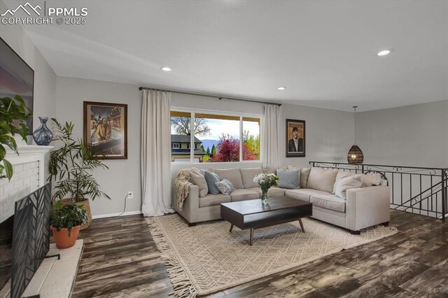 5064 Artistic Cir, Colorado Springs, CO 80917 - living area featuring recessed lighting, baseboards, a brick fireplace, and wood finished floors