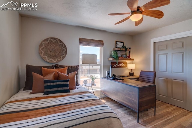 bedroom with ceiling fan and wood finished floors