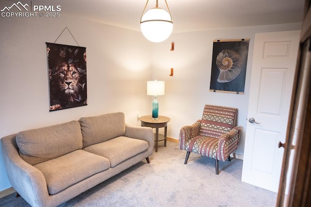 carpeted living room featuring baseboards